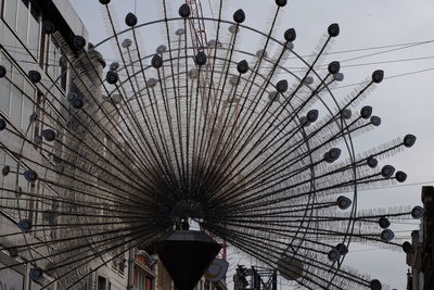 Low angle view of ferris wheel against sky