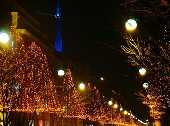 Low angle view of illuminated street light at night