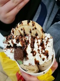 Close-up of hand holding ice cream