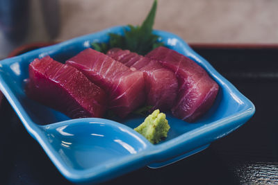 Close-up of fruits in plate on table