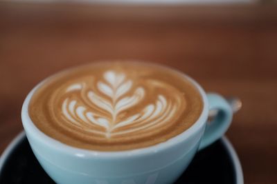 Close-up of cappuccino on table