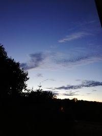 Silhouette trees against sky during sunset