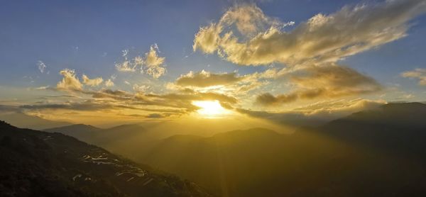 Scenic view of mountains against sky during sunset