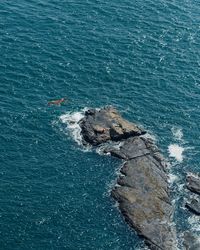 High angle view of boat sailing in sea