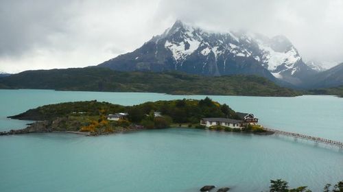 Scenic view of lake against cloudy sky