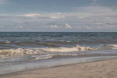 Scenic view of beach against sky during sunset