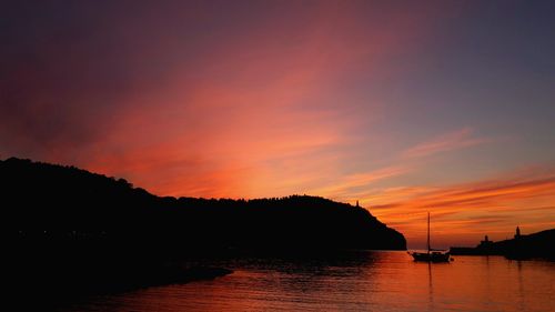 Scenic view of sea against orange sky