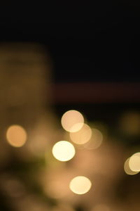 Defocused image of illuminated lights at night