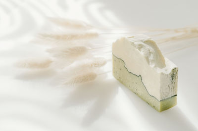 High angle view of bread on white table