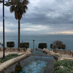 Scenic view of swimming pool by sea against sky