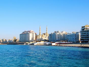 Buildings in city at waterfront