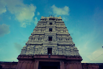 Low angle view of old building against blue sky