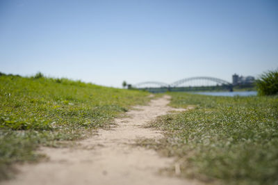 Surface level of field against clear sky