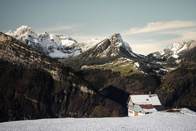 Scenic view of snowcapped mountains against sky