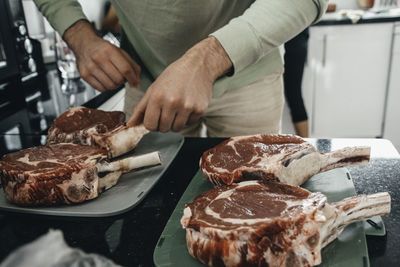 Midsection of man preparing food