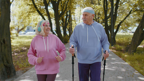 Rear view of couple standing in park