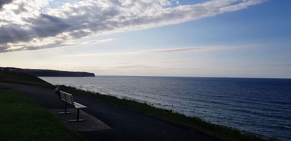 Scenic view of beach against sky during sunset