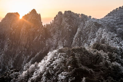 Scenic view of mountains against sky during sunset