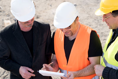 Engineers discussing at construction site