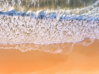 Close-up of waves rushing towards shore