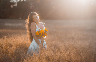 Woman standing on field