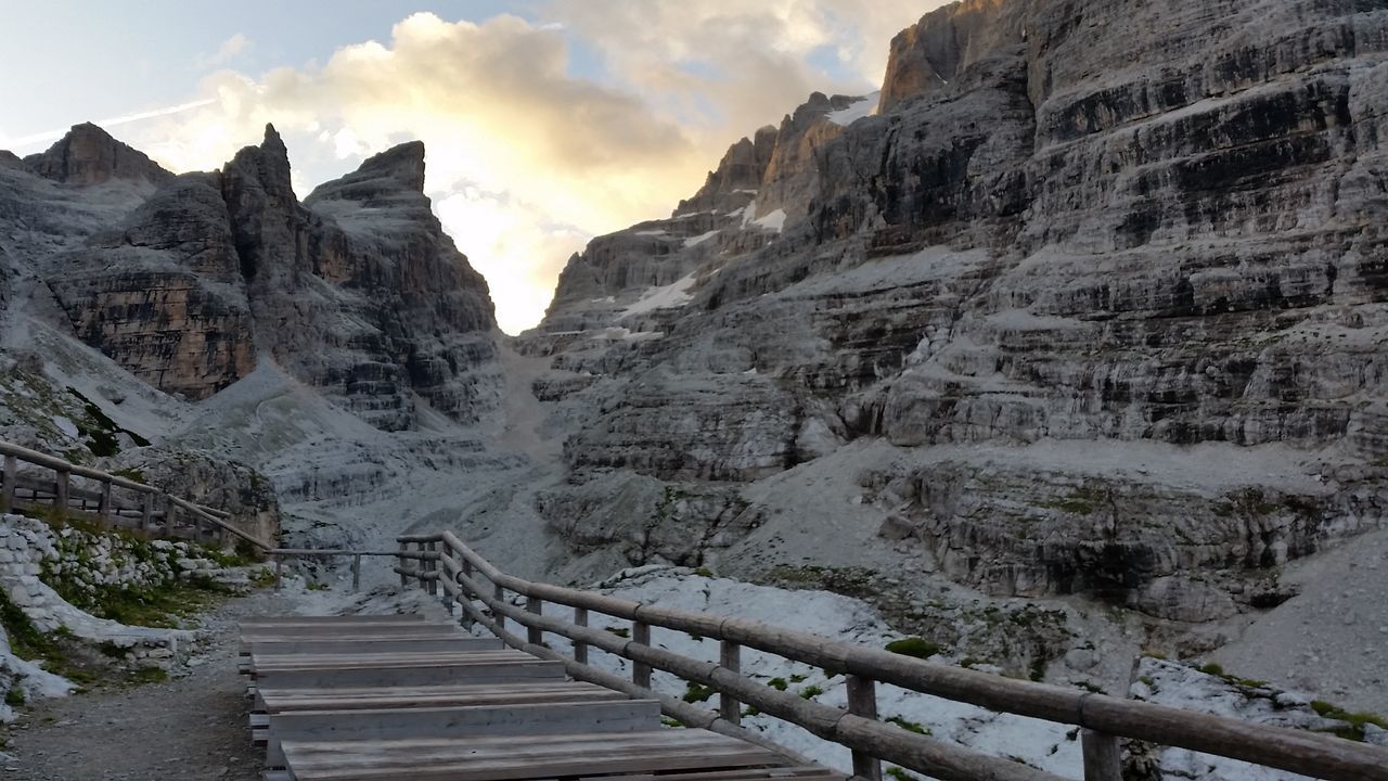 railing, steps, scenics, tranquil scene, mountain, beauty in nature, tranquility, sky, nature, outdoors, rocky mountains, day, majestic, mountain range, no people, tourism, rock formation, the way forward