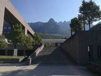 Staircase by building against sky