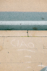 High angle view of chalk drawing on sidewalk