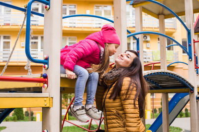 Full length of happy girl in playground