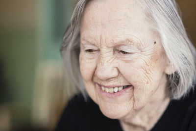 Close-up of smiling senior woman at nursing home