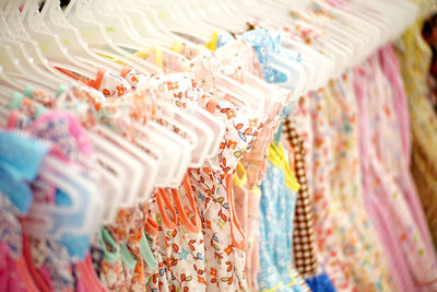 Full frame shot of multi colored clothes hanging for sale in market