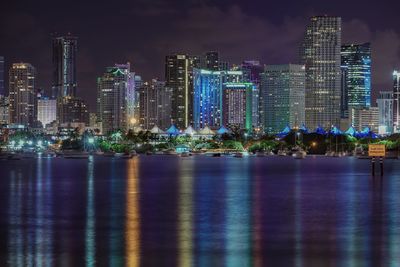 Illuminated city at waterfront