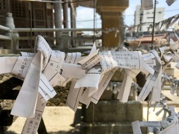 Fortunes prayers tied on pole at shrine