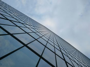 Close-up low angle view of tall building against sky