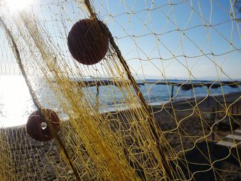 Low angle view of metal against sky