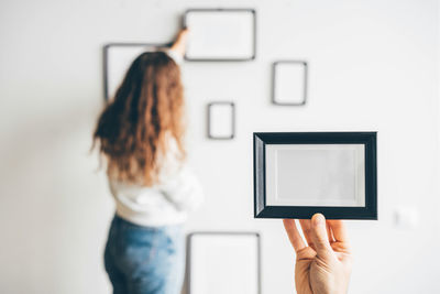 Midsection of woman using mobile phone