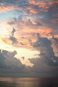 Scenic view of sea against sky at sunset