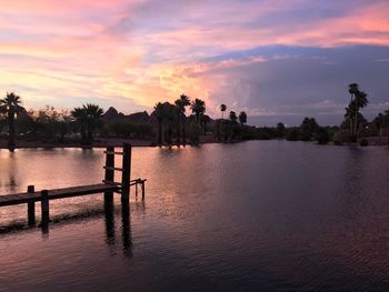 Scenic view of lake against sky during sunset