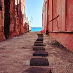 Steps on beach against sky