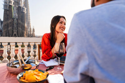 Portrait of smiling friends having food at restaurant