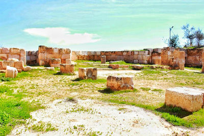 View of old ruins against cloudy sky