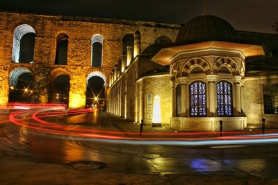 View of illuminated road at night