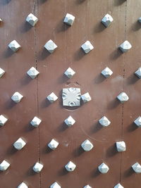 Full frame shot of wooden wall with stone pattern