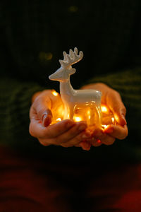 Cropped hand of woman holding heart shape