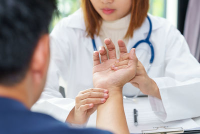 Midsection of woman with hands