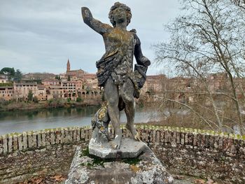 Low angle view of statue against sky