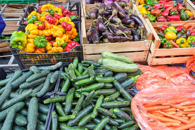 Gherkins, carrots, peppers and aubergines for sale at a market