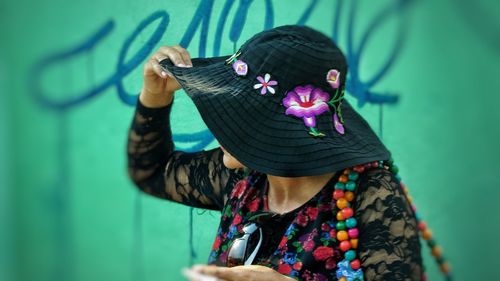 Midsection of woman holding umbrella