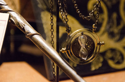 Close-up of chain hanging on table