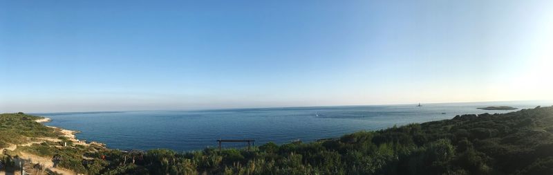 Scenic view of sea against blue sky